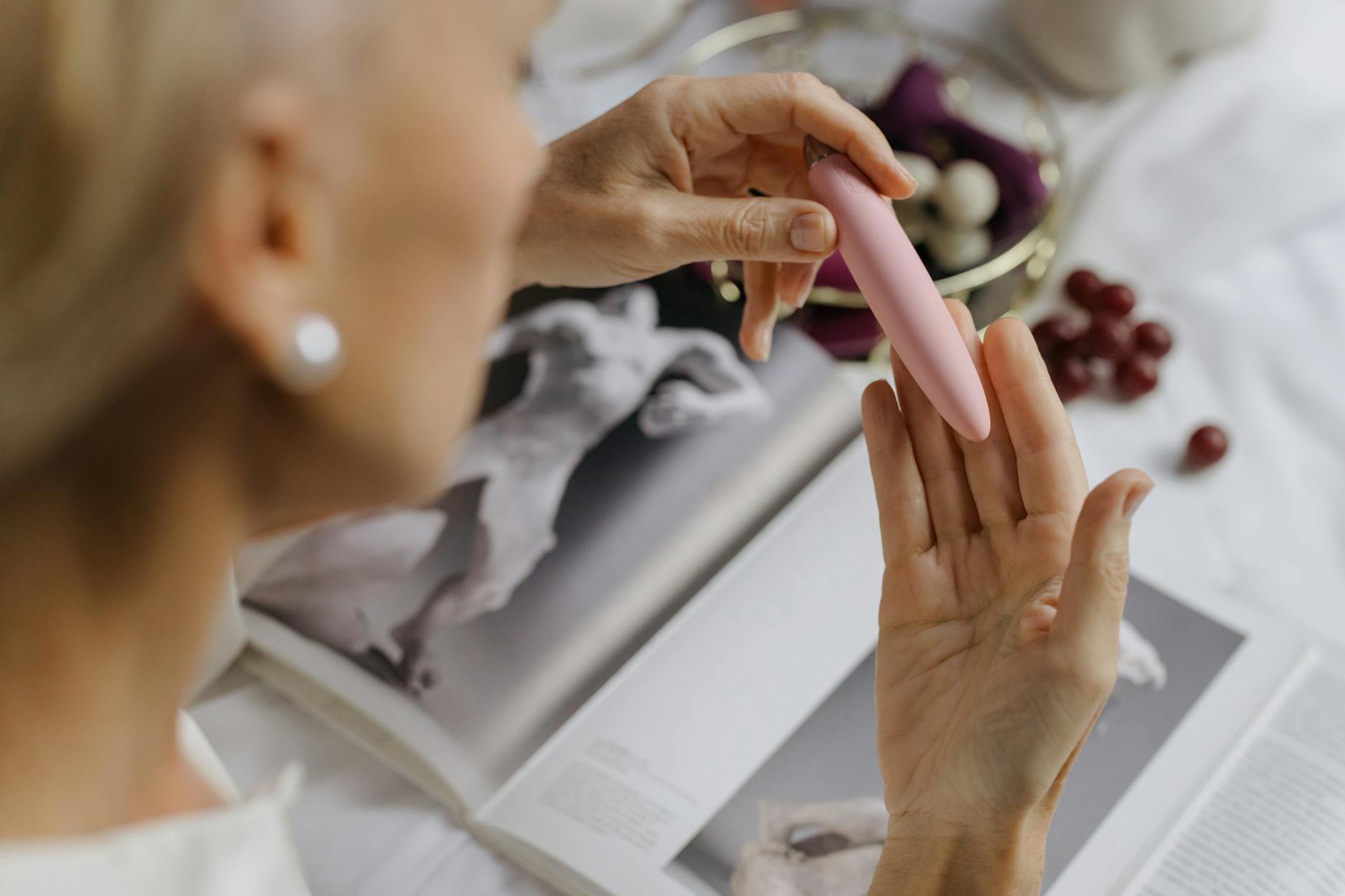 Close-up of hands exploring a lemon vibrator together, symbolizing intimate reconnection and trust building between partners.
